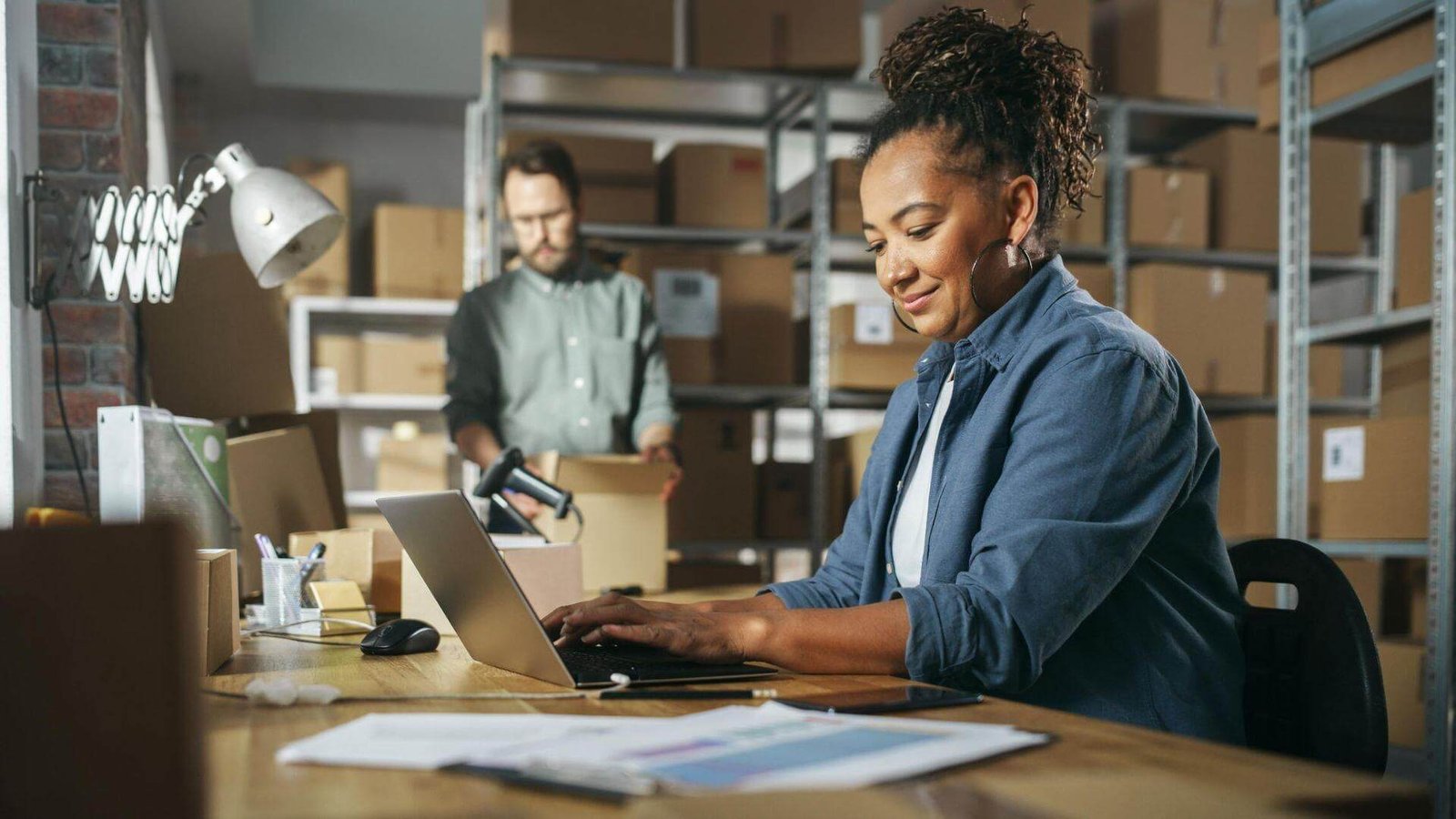 A business owner packing customer orders